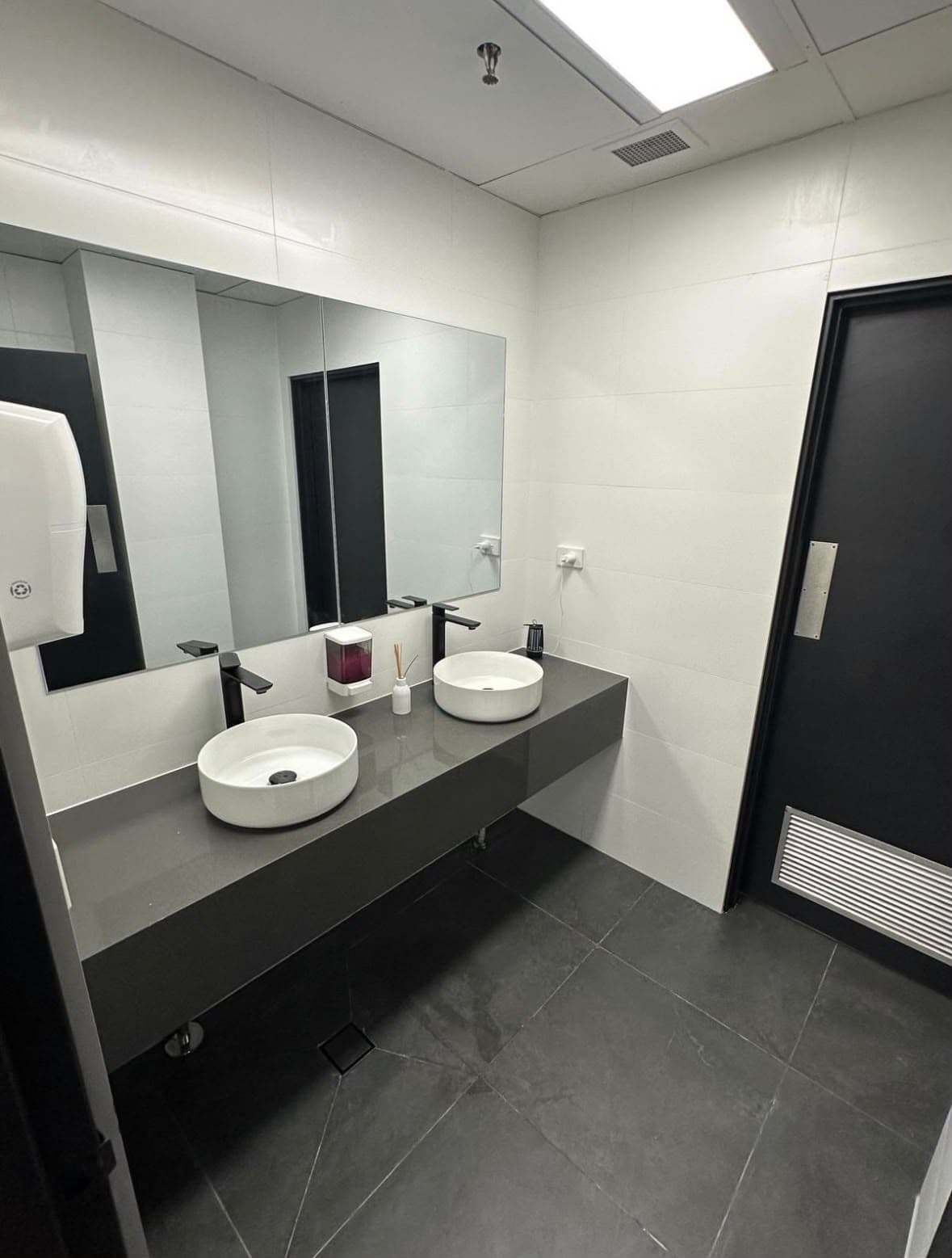 The same commercial washroom after a Capital Cleaning Company clean, spotless