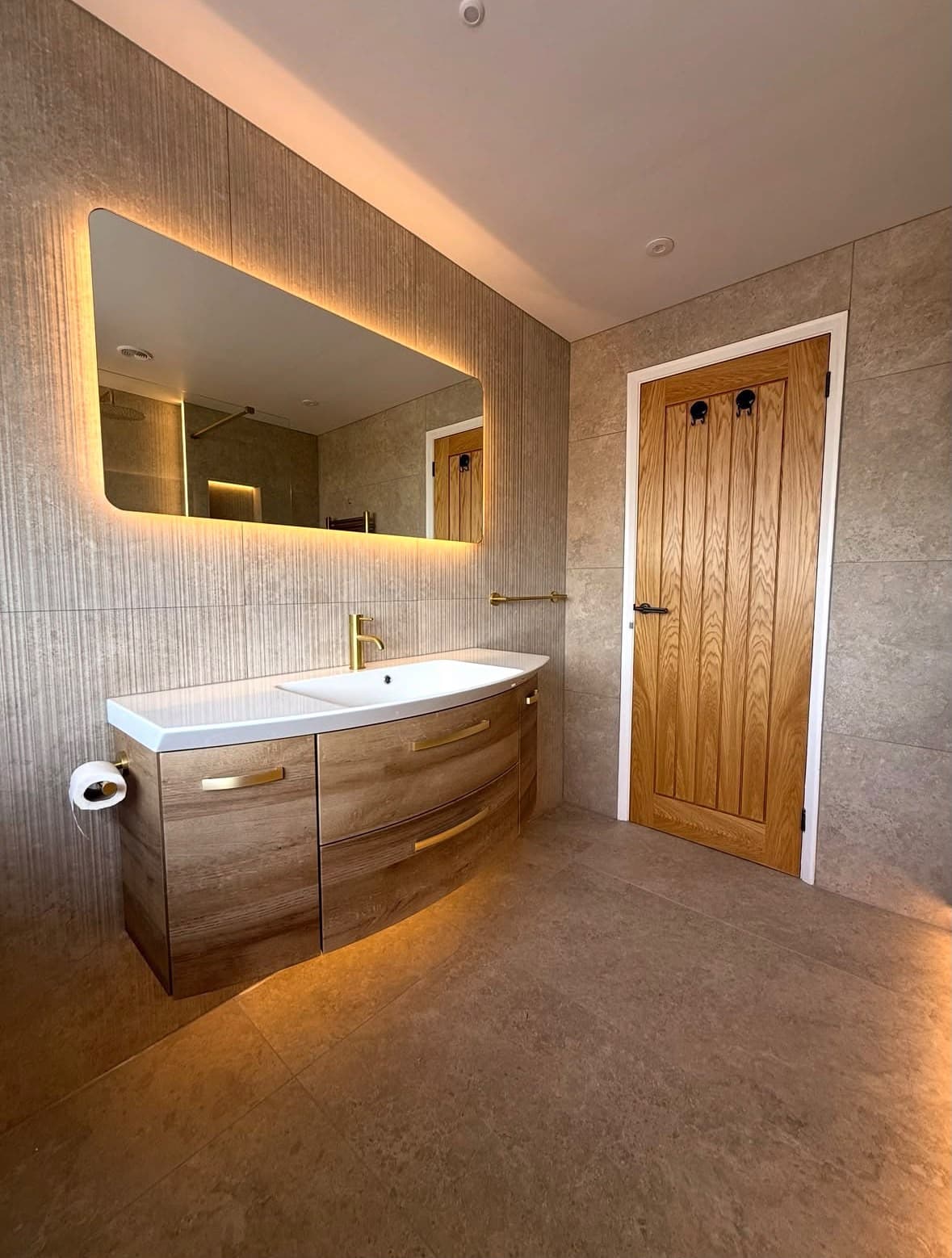 A bathroom vanity and mirror cleaned to a spotless finish